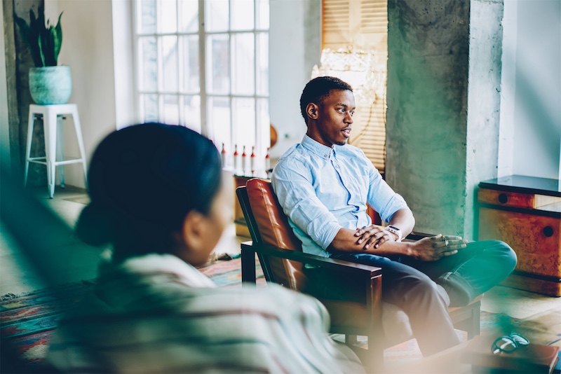 compressed pensive black man listening comfortably sitting in 2023 12 14 04 43 04 utc